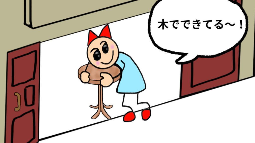 倉庫に入って、実際テーブルを触ってみて、木でできていると理解した女の子